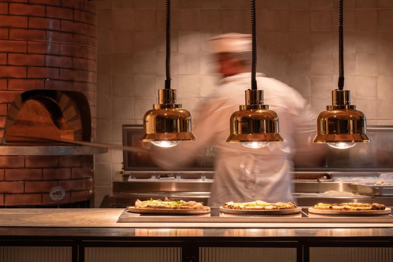 Helea Lifestyle Beach Resort Каллифея Экстерьер фото Pizzas being prepared at a restaurant